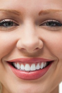Close-up of a smiling woman staring at the camera